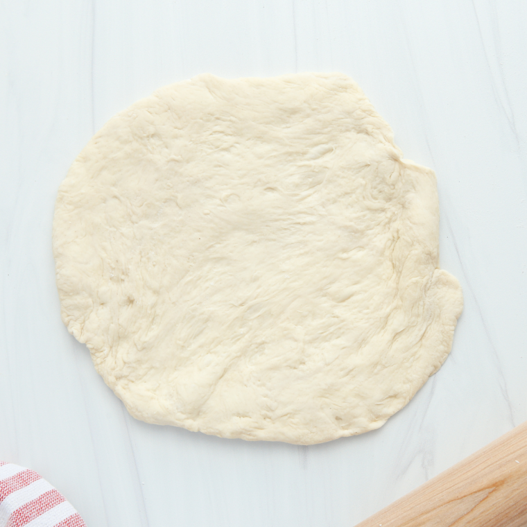 Powdered sugar and milk whisked into a thin icing for cherry dessert pizza