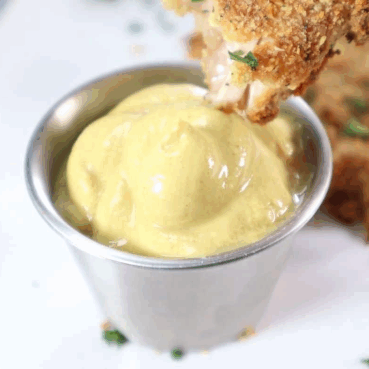 Crispy air fryer McDonald’s-style chicken nuggets served with dipping sauce.