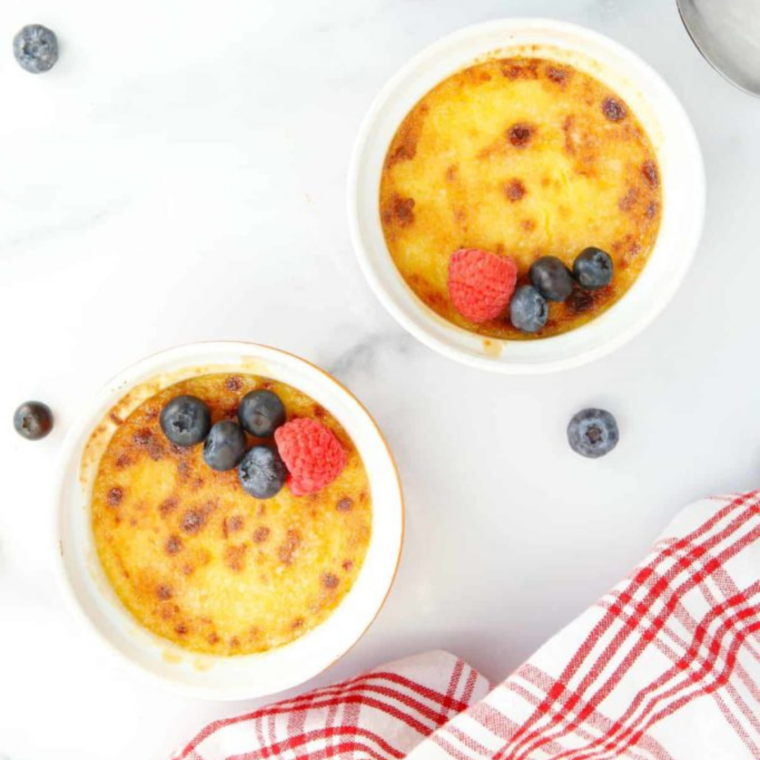 Silky custard on a spoon above a ramekin of creme brulee