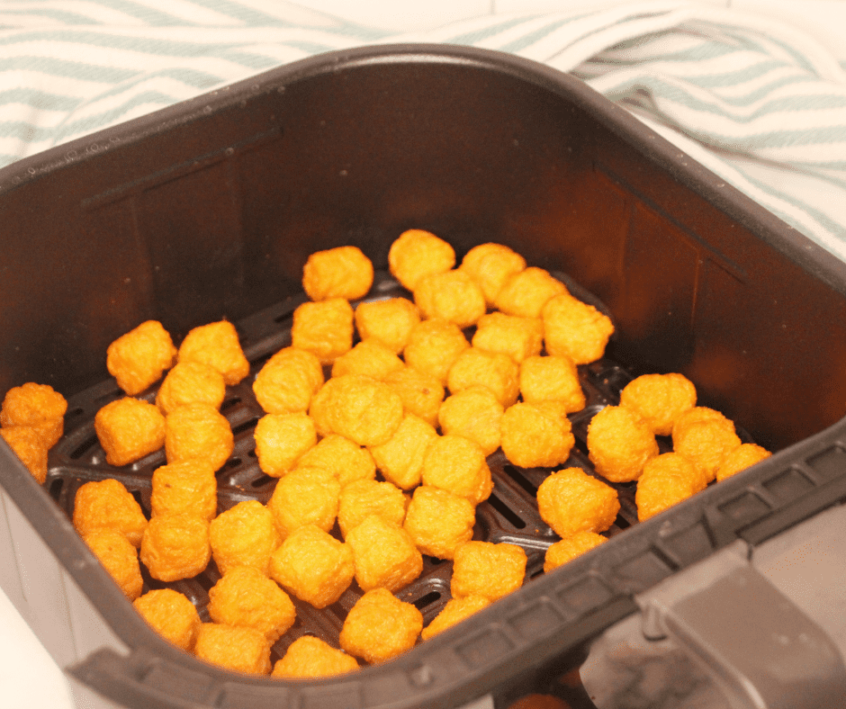 A plate of crispy Air Fryer Frozen Sweet Potato Tots, golden brown and delicious."