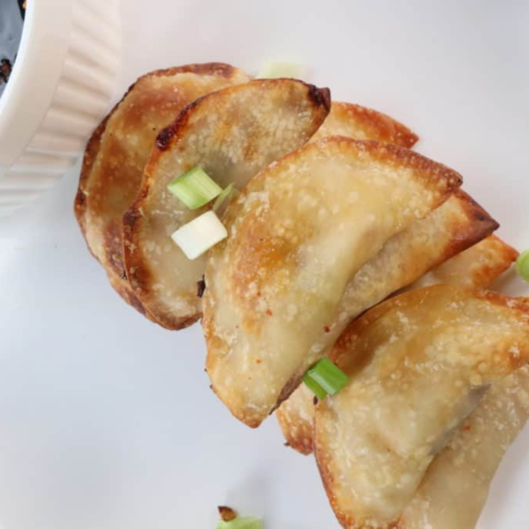 Preheat the Air Fryer:
Preheat your air fryer to 375°F (190°C). This step ensures a crispy texture.
Cook the Pot Stickers:
Lightly brush or spray the air fryer basket with oil to prevent sticking.
Place the pot stickers in a single layer in the basket, making sure they are not touching (cook in batches if necessary).
Lightly brush or spray the tops of the pot stickers with oil. This will help achieve a golden color.
Air fry for 8-10 minutes, or until they are golden brown and crispy, flipping halfway through the cooking time.
Serve:
Serve the pot stickers hot with your choice of dipping sauce, like soy sauce or a mixture of soy sauce and rice vinegar.