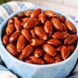 Air fryer honey roasted almonds in a white bowl