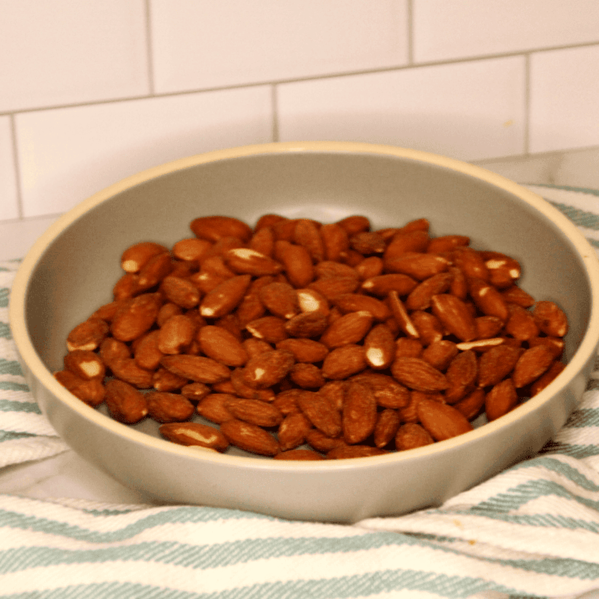 Ingredients needed for Air Fryer Honey Roasted Almonds on kitchen table.