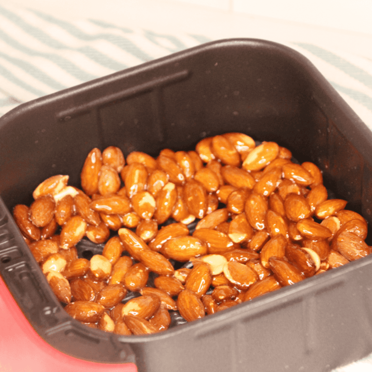 Place the Honey Roasted Almonds in the air fryer basket.