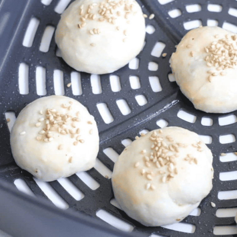 Brushing the tops and sides of the Sloppy Joe Bites with egg and adding toasted sesame seeds before air frying.