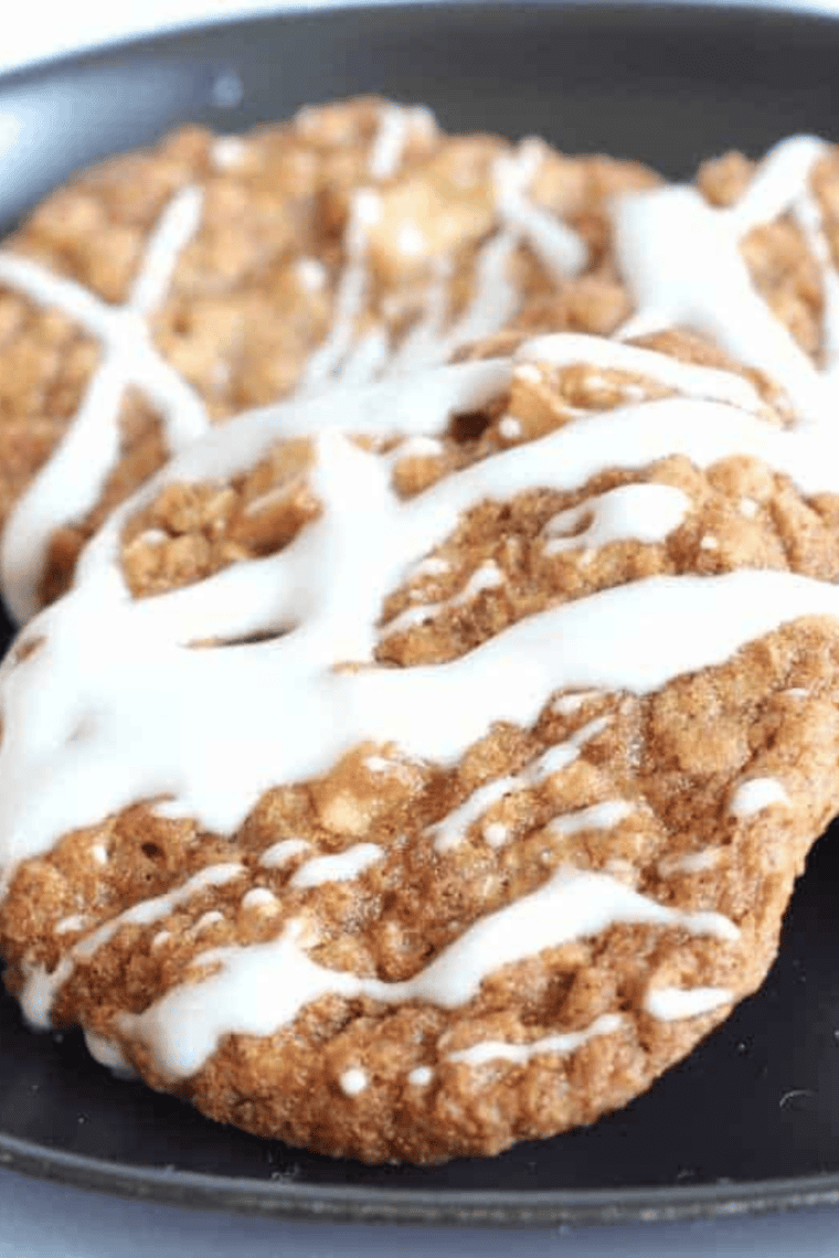 Freshly baked air fryer apple cinnamon oatmeal cookies on a cooling rack.