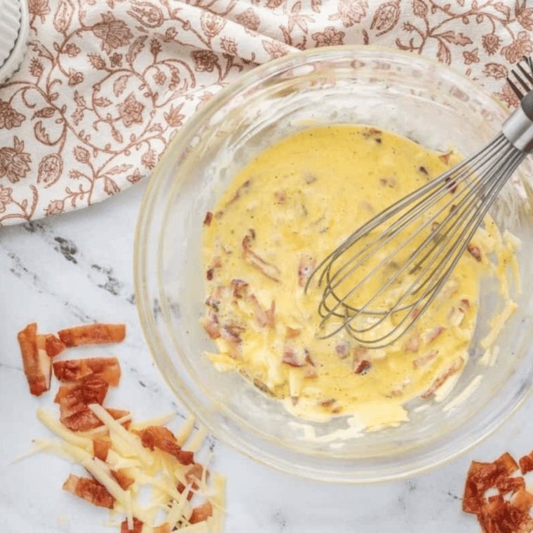 Add frittata ingredients to a large mixing bowl and whisk until well combined.