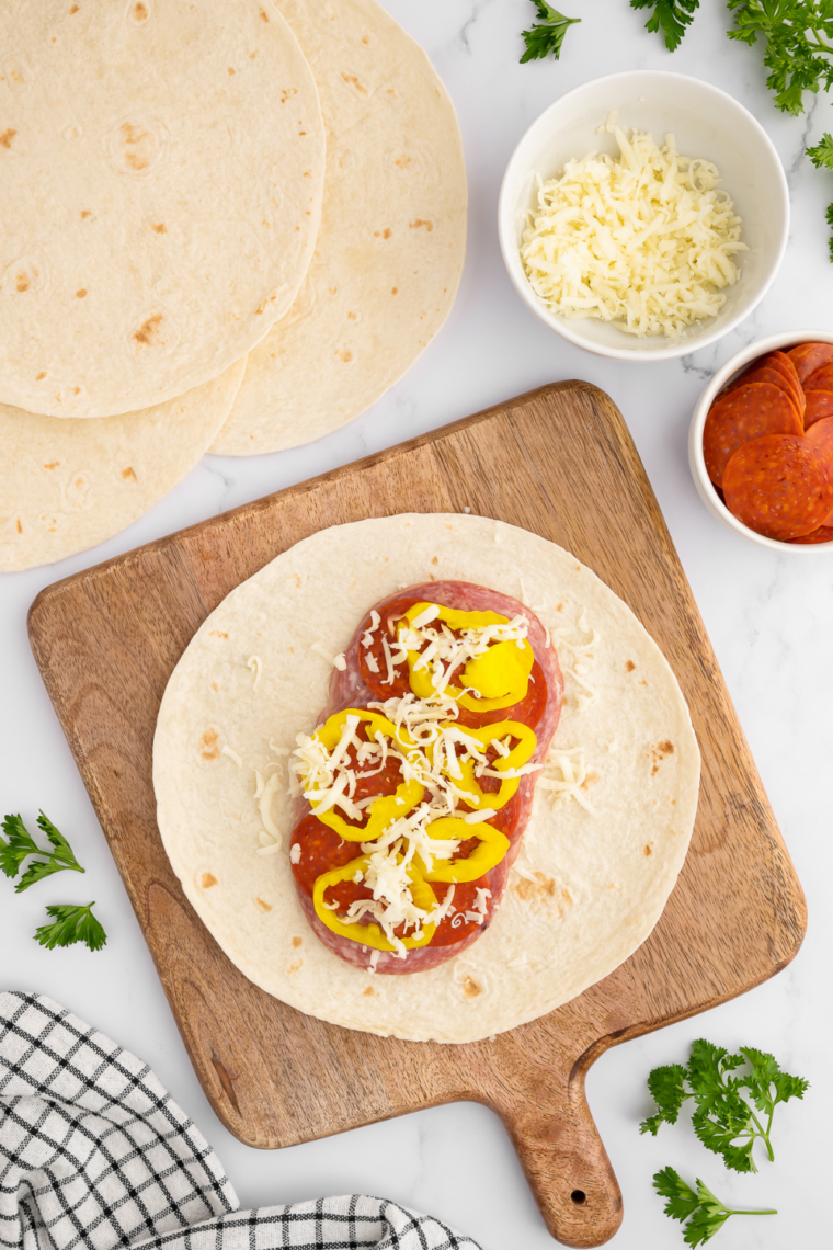 Soft, warm tortillas stacked on a plate, ready for serving.