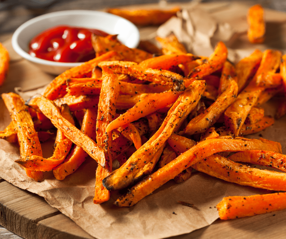 Crispy, golden sweet potato fries reheating in the air fryer for the perfect crunch.
