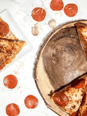 Reheated Pizza Hut Original Pan slice on a white plate with a crispy golden-brown crust edge