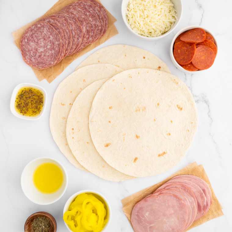 Stack of warm, soft tortillas on a plate, ready to serve.
