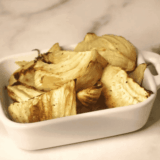 Plate of air fryer fennel wedges with caramelized golden-brown edges