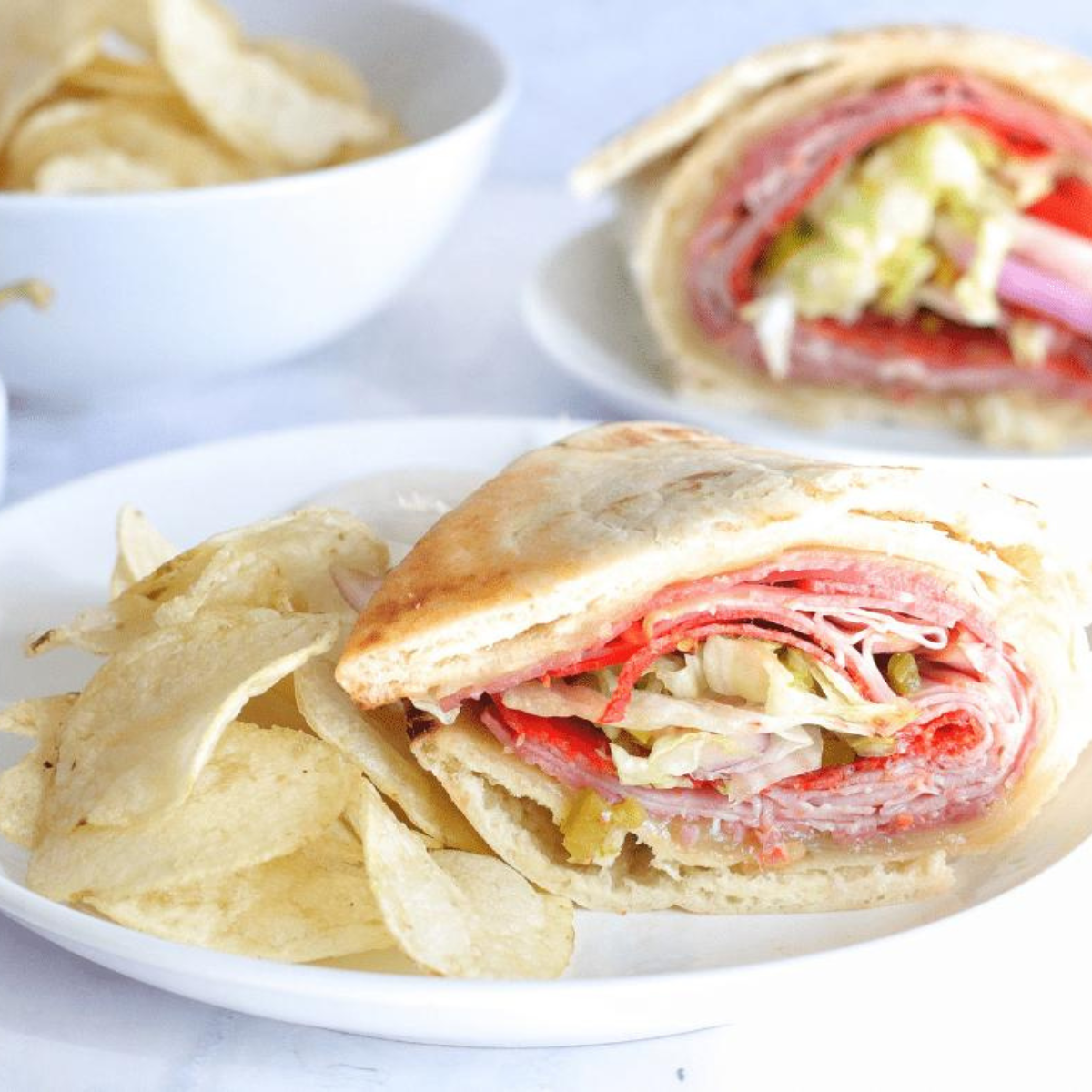 Crispy Air Fryer Flatbread Sandwich filled with fresh veggies, cheese, and protein