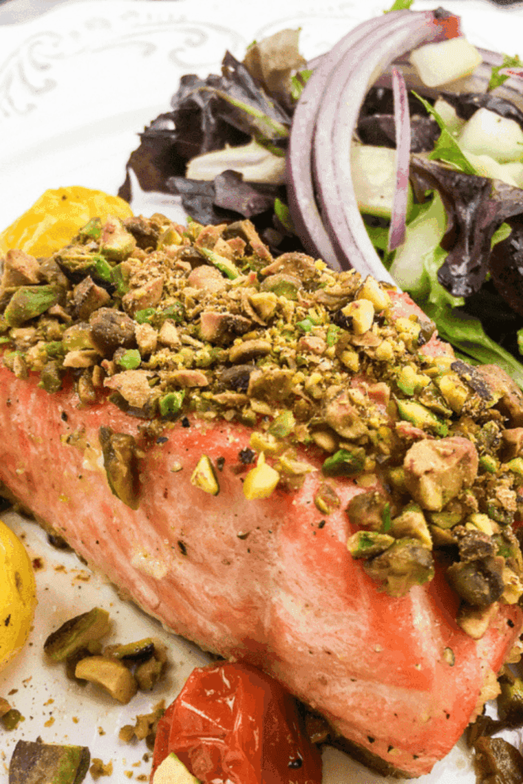 Air fryer pistachio-crusted salmon with crispy golden topping, served on a plate