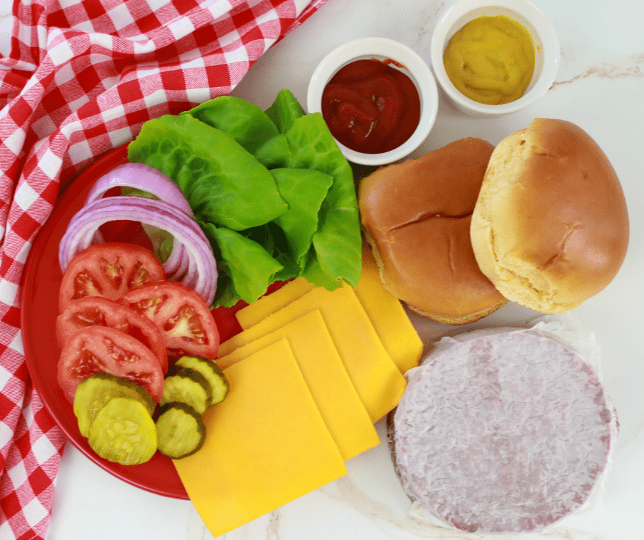 Below are the step-by-step directions for making these vegan burgers. The air fryer is truly the best way to make a batch:

​

​

Preheat the Air Fryer: Set the air fryer to around 375°F (190°C). Preheating helps to cook the veggie burger evenly.

Place the Veggie Burgers in the Air Fryer: Arrange the frozen veggie burgers in a single layer in the Air Fryer basket. Ensure they're not overlapping for even cooking.

Cooking Time: Air fry the veggie burgers for about 8-10 minutes. Halfway through the cooking time, you might want to flip the burgers to ensure they cook evenly on both sides. If you want to add a cheese slice, add a slice of cheese on top of the delicious veggie burgers, and then air fyr for another 3-4 minutes at 300 degrees F.

Check for Doneness: Most frozen veggie burgers come pre-cooked, so you're reheating them and adding crispiness. They should be heated through and crispy on the outside.

Serving: Add your favorite toppings.

Remember, cooking times may vary slightly based on the air fryer model and the thickness of the veggie burgers. Always refer to the specific instructions on the veggie burger packaging if available. Enjoy your delicious, crispy veggie burgers straight from the air fryer – perfect for a healthy and convenient meal!
