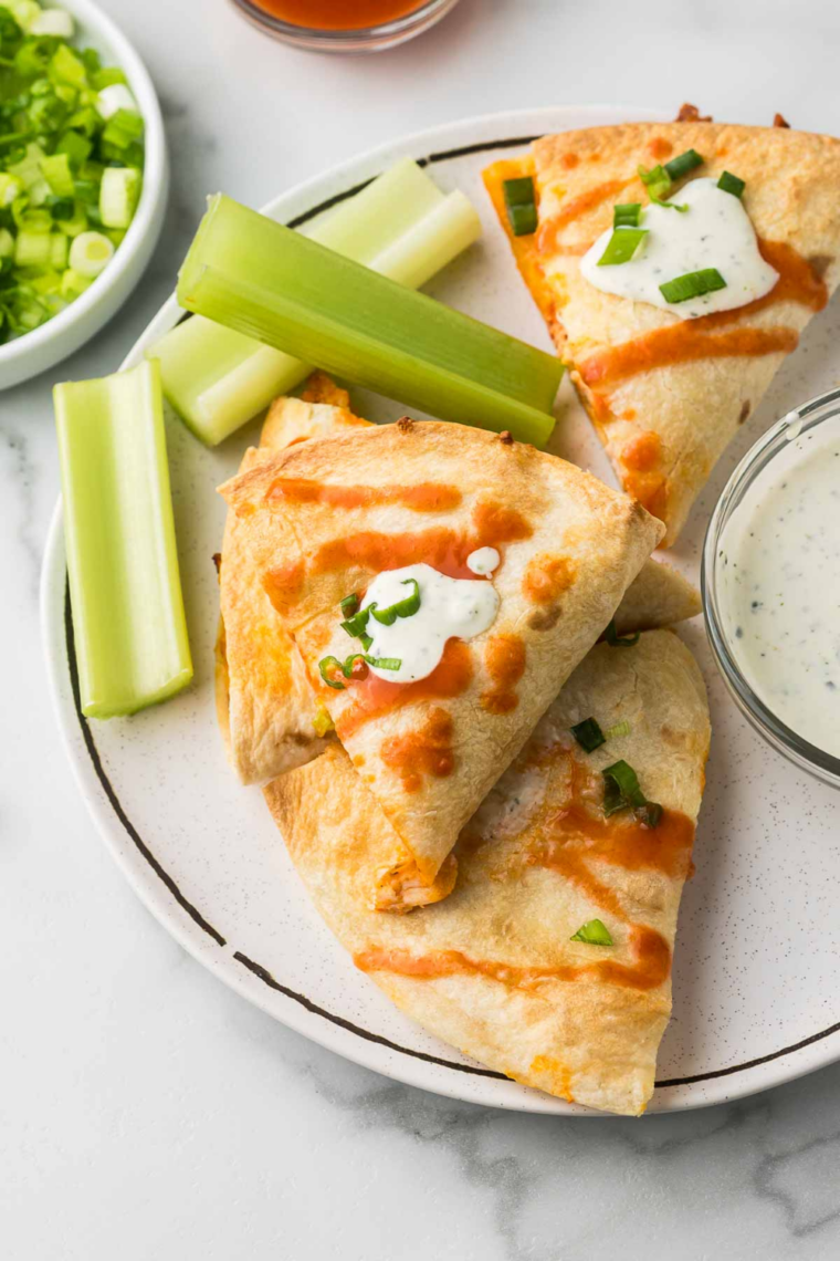 Crispy chicken quesadilla cooked on a Blackstone griddle with melted cheese and salsa