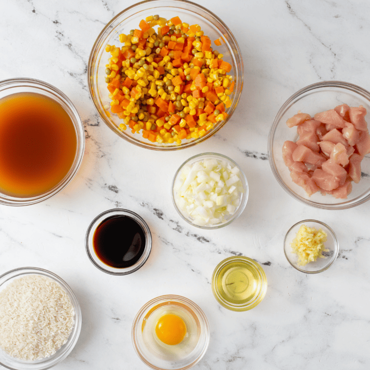 Ingredients needed for Panda Express Fried Rice Recipe on kitchen table.