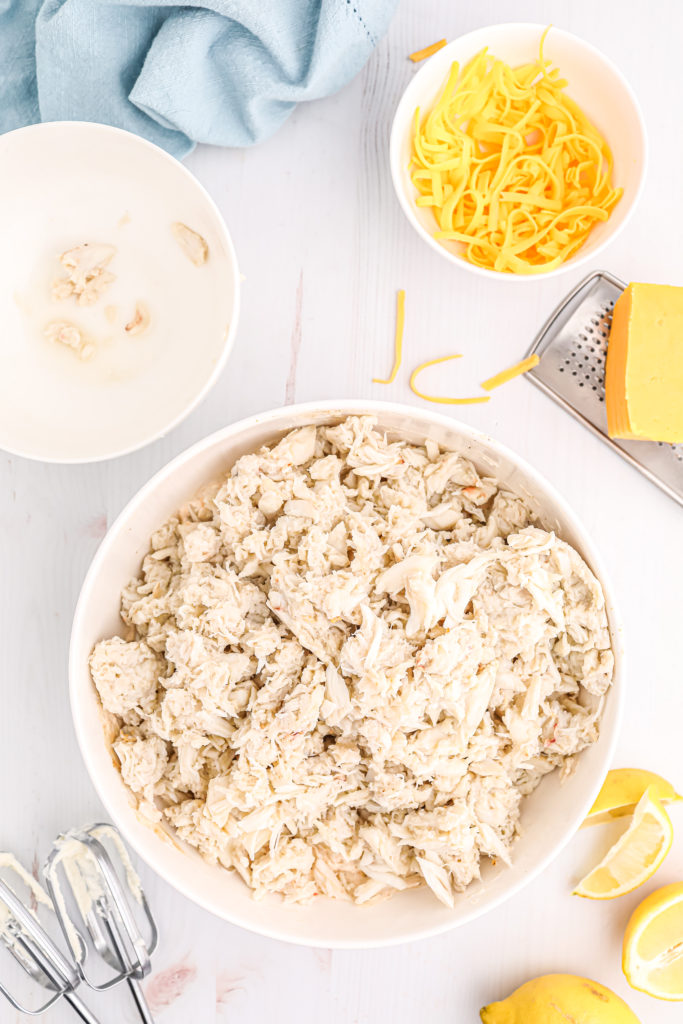 Transferring the crab mixture into a baking dish suitable for the air fryer.