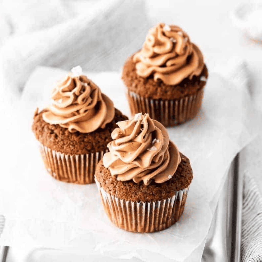 Air Fryer Double Chocolate Sea Salt Cupcakes topped with chocolate frosting and sea salt sprinkles.