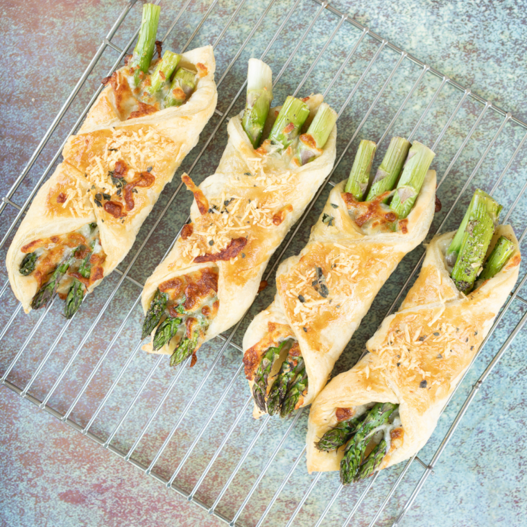 Air Fryer Asparagus Puff Pastry Bundles on wire rack to cool slightly, before serving.