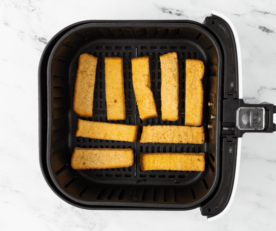 Place Copycat BK French Toast sticks into the air fryer basket, in a single layer.