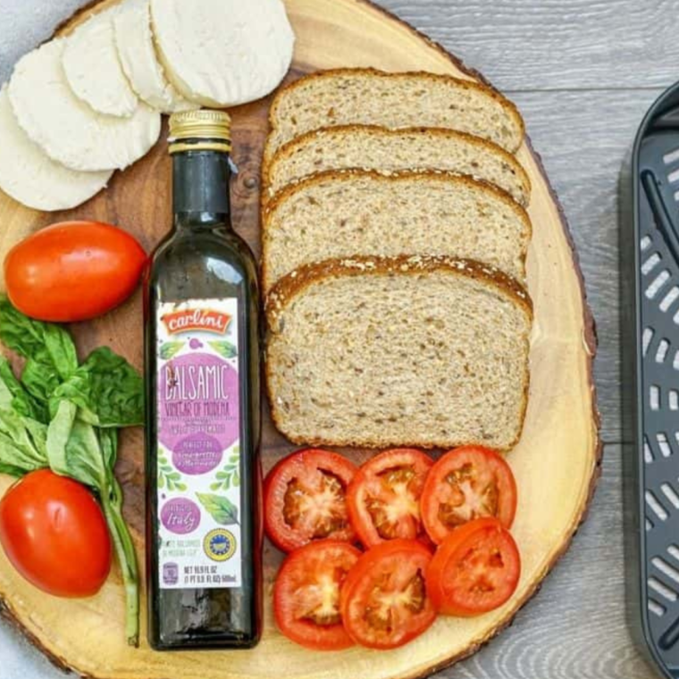 Ingredients needed for Air Fryer Caprese Sandwiches on cutting board.