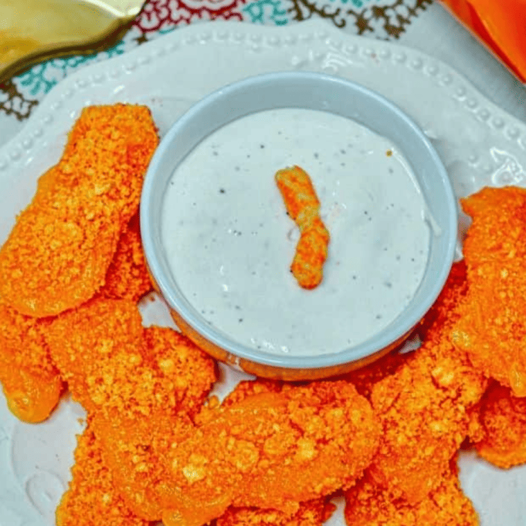 Crispy air fryer mozzarella sticks resting briefly after cooking, served hot with dipping sauces like marinara and ranch.