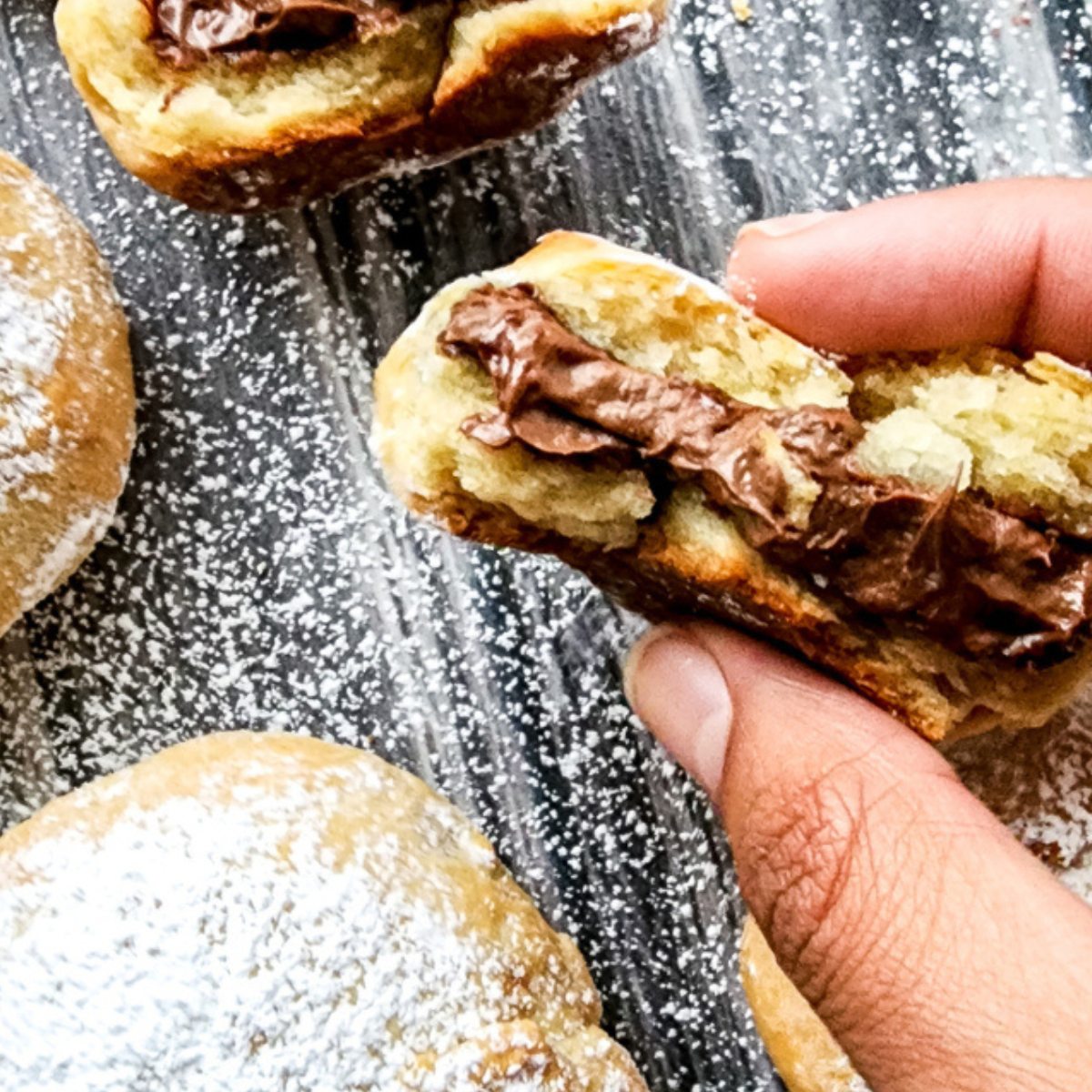 Air Fryer Nutella Bombs with a golden crispy exterior and melted Nutella filling.