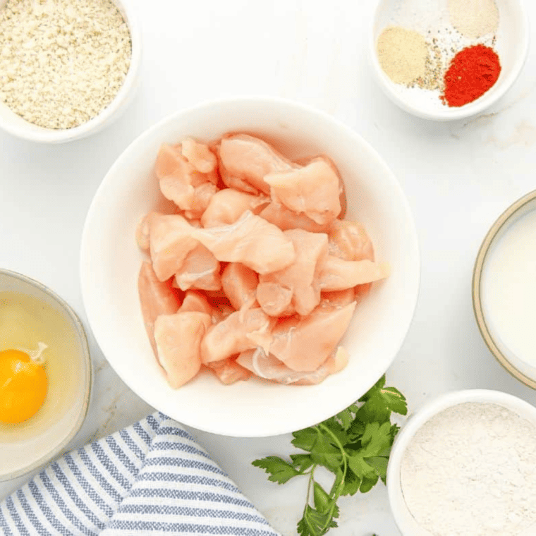 Ingredients Needed For Homemade Popcorn Chicken on kitchen table.