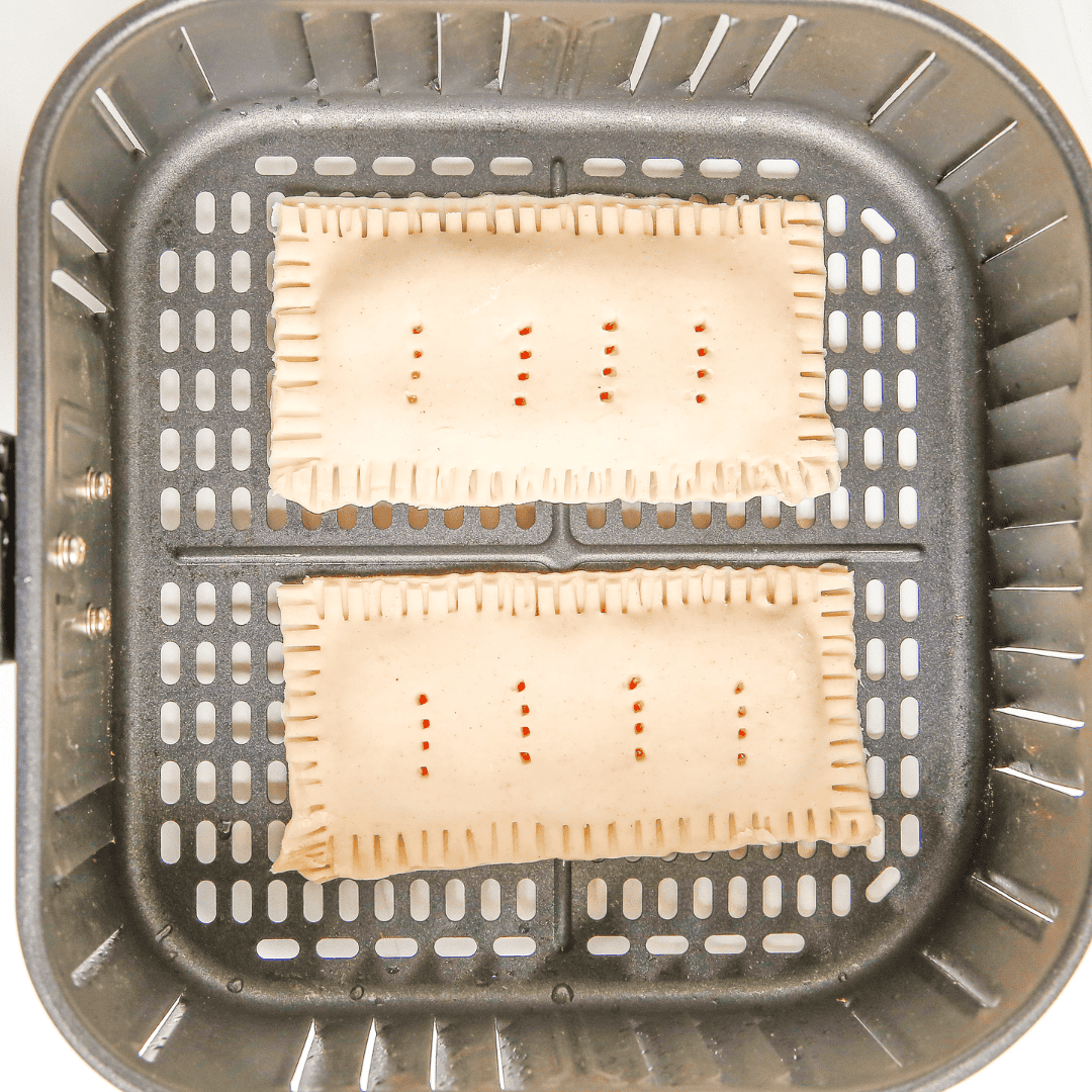 "Air Fryer Pumpkin Pop-Tarts cooking in the air fryer"