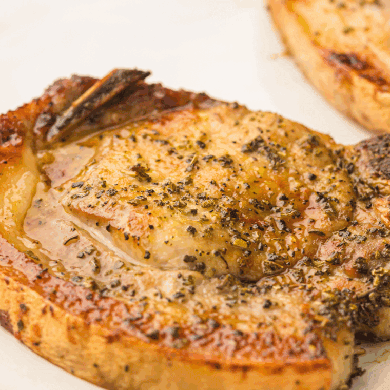 Close-up of crispy ranch-seasoned pork chops fresh out of the air fryer basket