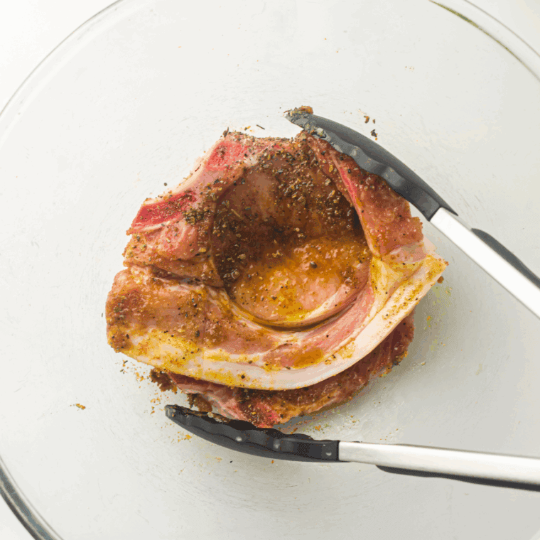 Pork chops brushed with oil and sprinkled with ranch seasoning, garlic, salt and pepper