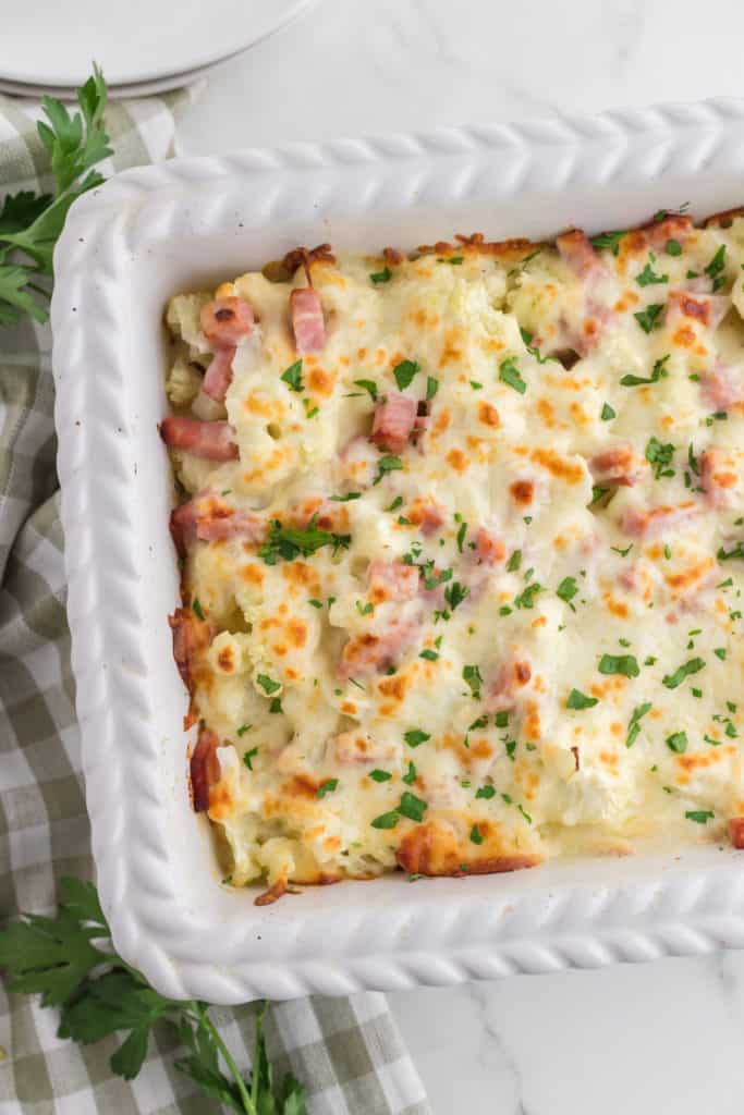 "Golden and bubbling cauliflower cheese freshly baked in the air fryer."