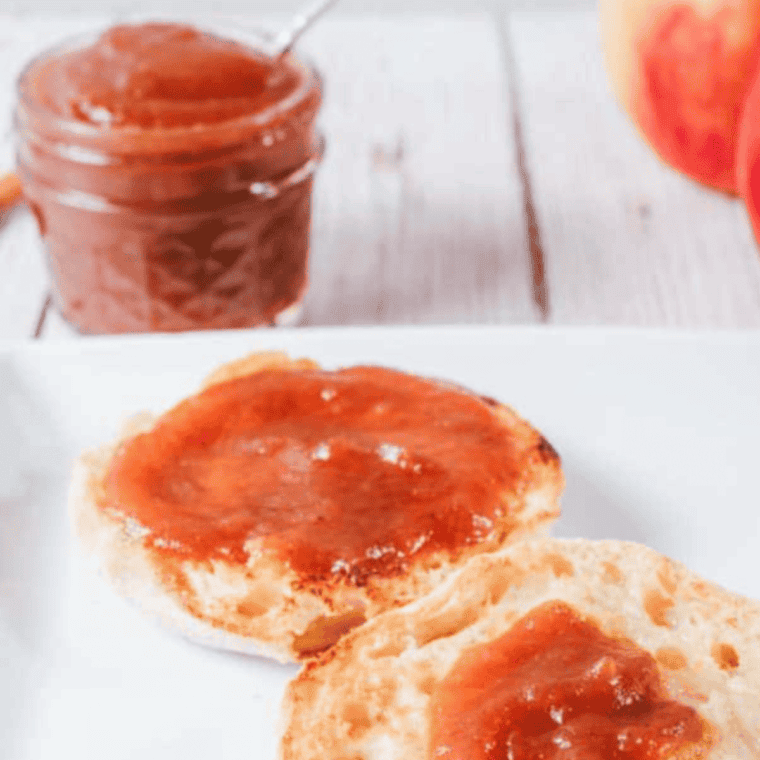 Homemade Cracker Barrel apple butter spread on toast with apples and spices
