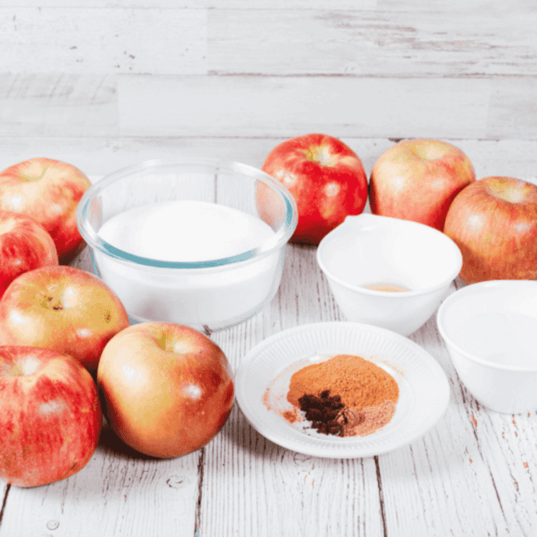 Ingredients needed for Cracker Barrel Apple Butter Recipe on kitchen table.