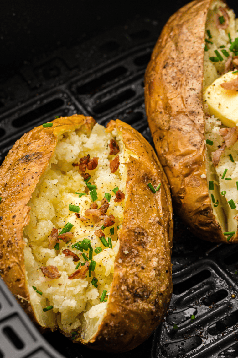 Golden-brown air fryer steakhouse potatoes, crispy outside and fluffy inside, served on a plate.