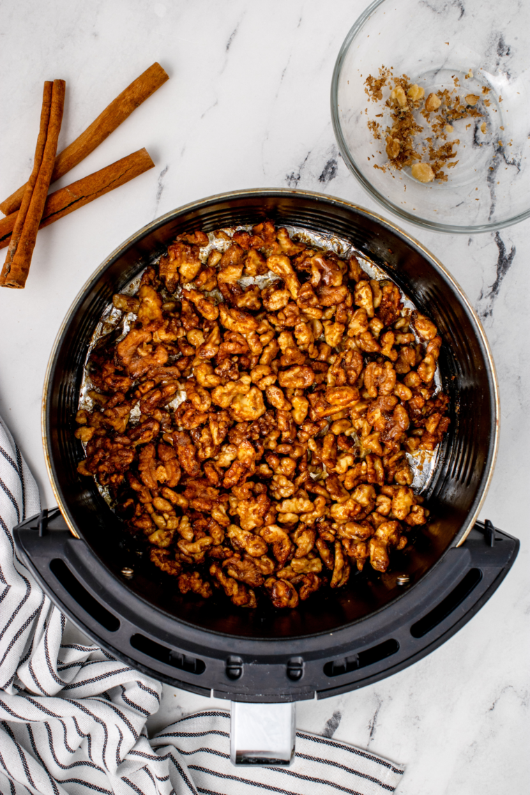 Close-up of caramelized walnuts coated in honey after air frying