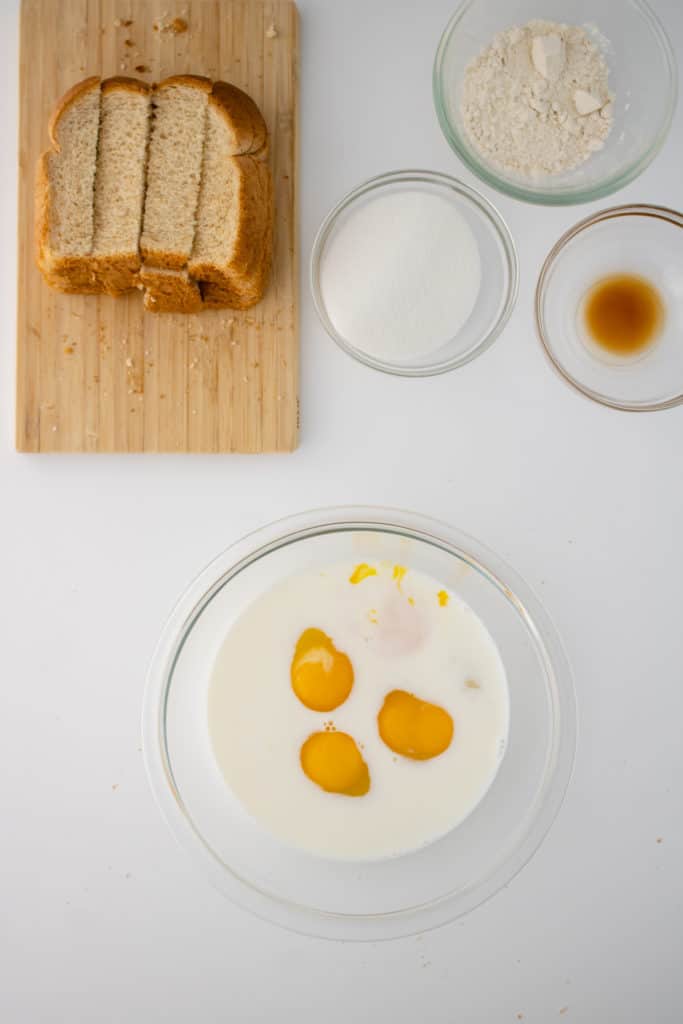 Prepare the French toast batter in a large mixing bowl.