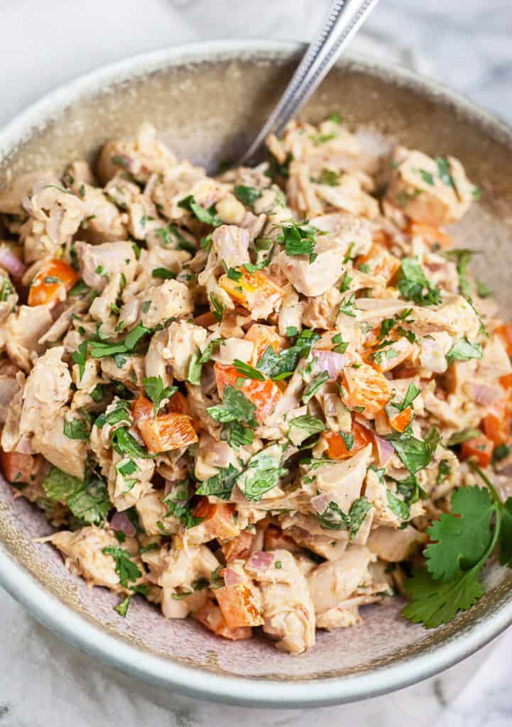 Air Fryer Southwestern Chicken Salad drizzled with zesty dressing on a plate.
