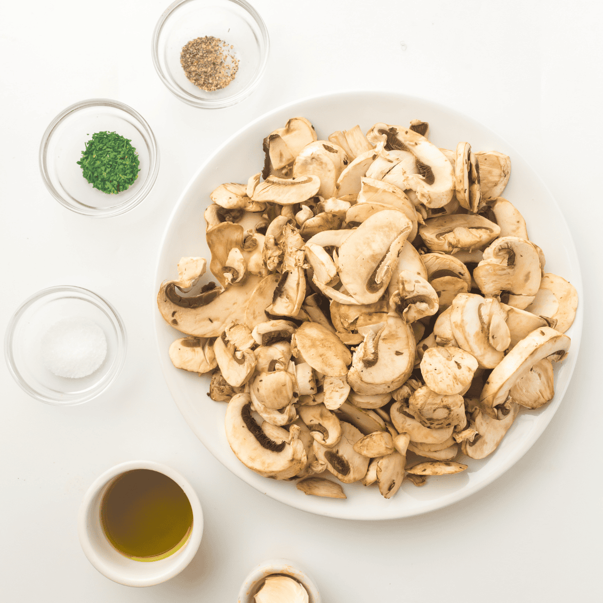 Ingredients needed for Texas Roadhouse Sauteed Mushrooms Recipe on kitchen table.