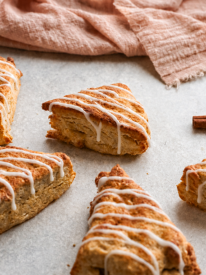 Overhead view of glazed air fryer apple scones with visible pieces of diced apple
