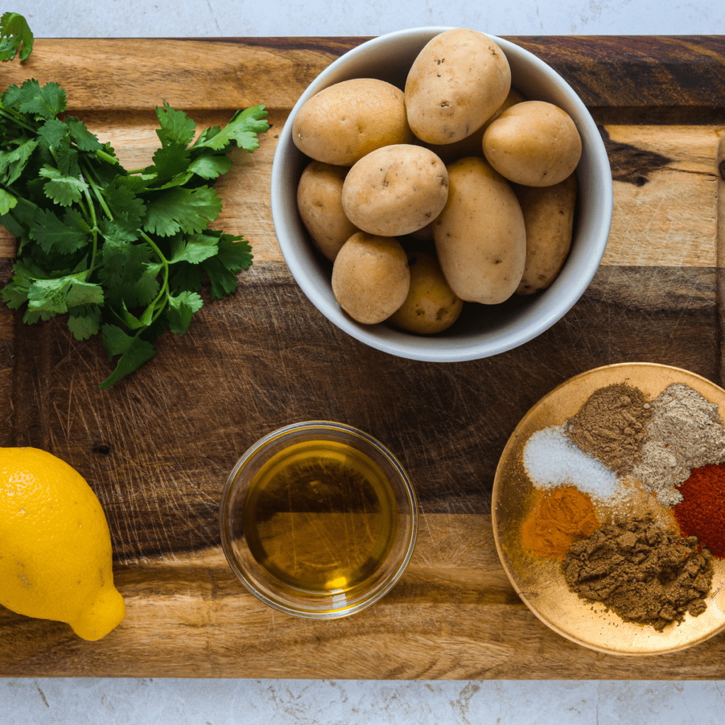 Ingredients For Air Fryer Bombay Potatoes on kitchen table.