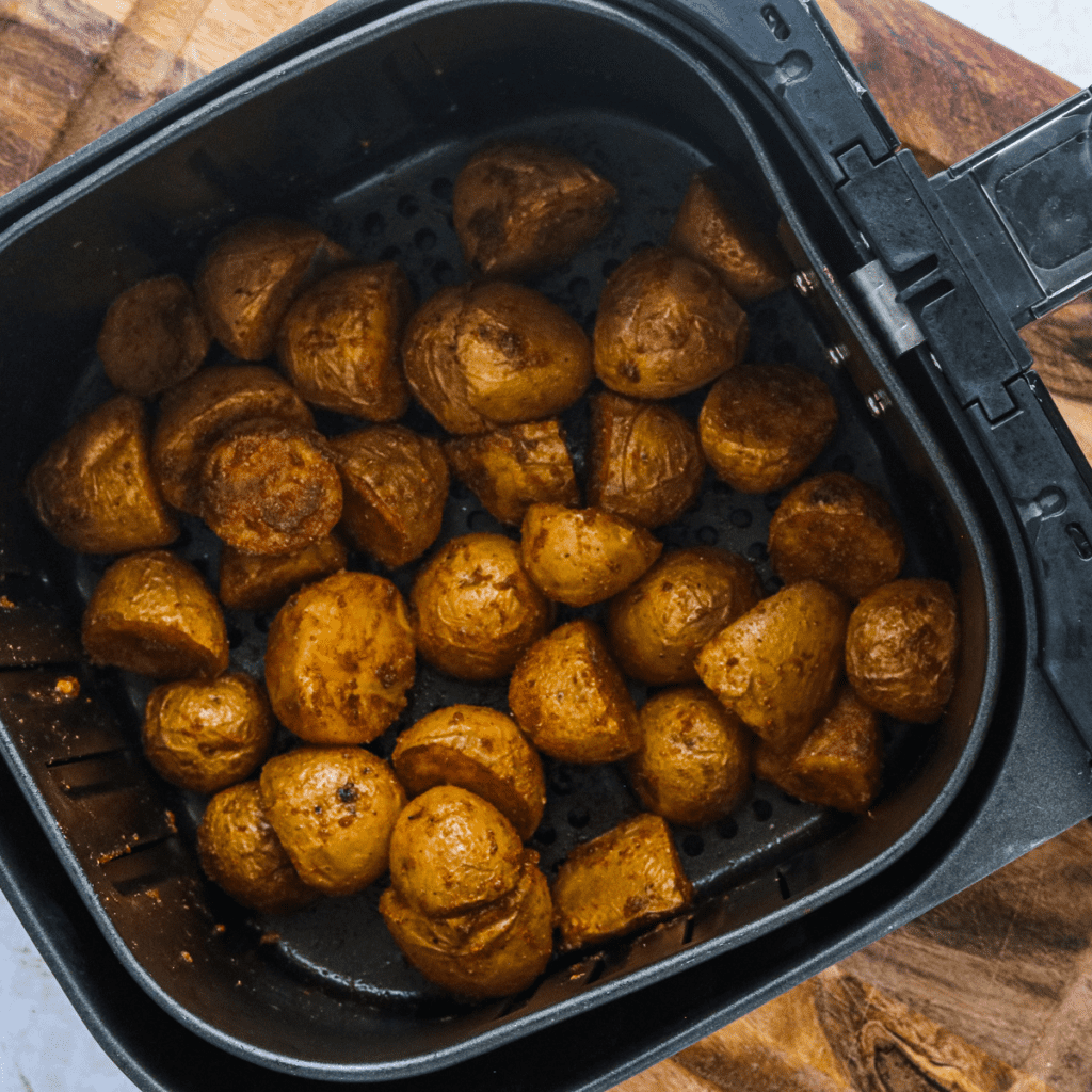 Serving Bombay potatoes with a squeeze of lemon juice and garnishing with fresh herbs