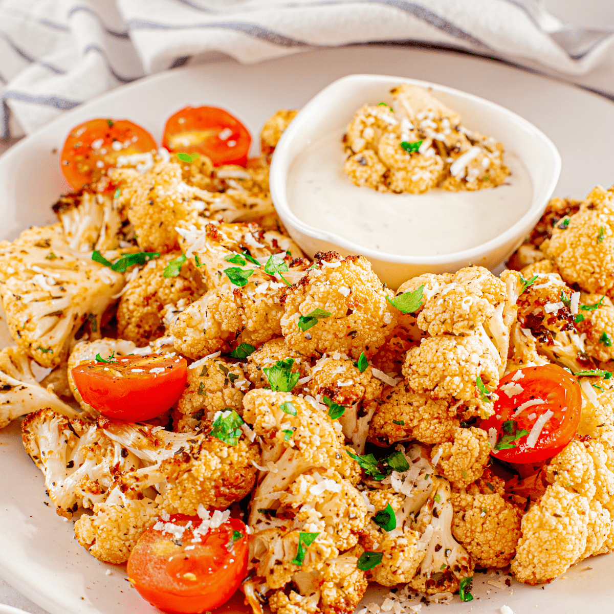 Air-Fryer-Cauliflower-and-Tomatoesgetables for extra variety? Whatever you choose to do, our air fryer cauliflower with tomatoes dish is sure to be a hit!