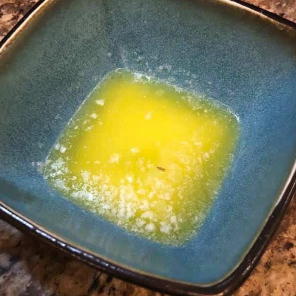 Add your biscuit dough into the melted butter.