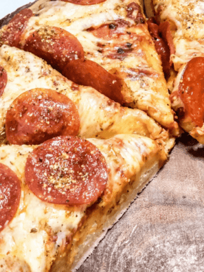 Close-up of copycat Pizza Hut pan pizza made in the air fryer, showing the crispy golden fried crust edge and bubbling mozzarella