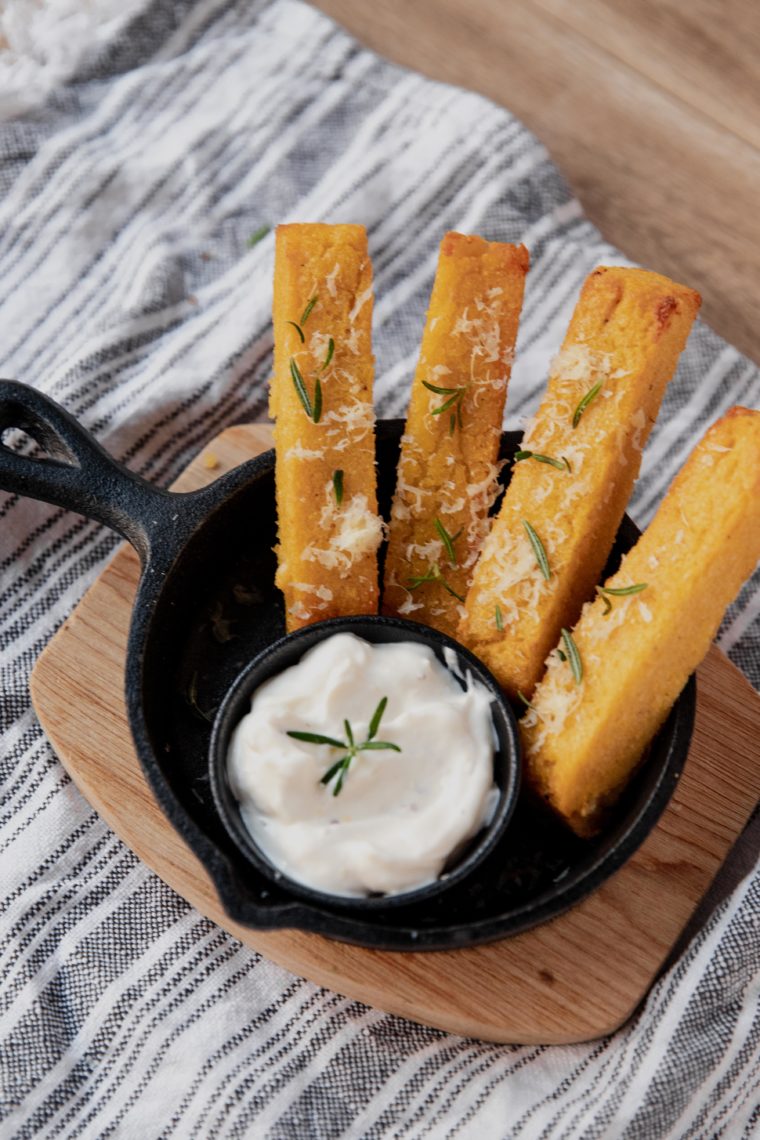 Close-up of crispy polenta fries showing the golden exterior