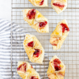 Flaky air fryer puff pastry Danish showing golden layered edges and jam center