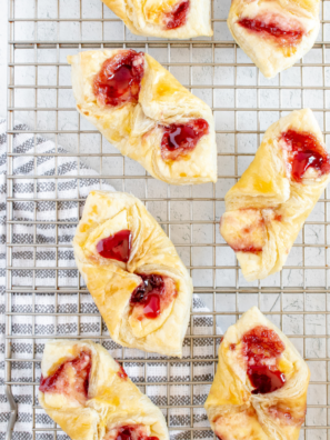 Flaky air fryer puff pastry Danish showing golden layered edges and jam center