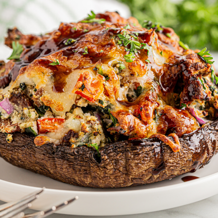 There are several reasons why you will love this recipe for Air Fryer Stuffed Portobello Mushrooms, making it a go-to choice for a delightful culinary experience: Flavorful and Satisfying: Combining juicy portobello mushrooms with rich and savory stuffing creates a mouth-watering dish. The flavors are well-balanced, ensuring each bite is packed with deliciousness. Healthier Option: Cooking in an air fryer requires significantly less oil than traditional frying methods, making these stuffed mushrooms a healthier alternative without sacrificing taste or texture. Quick and Easy: One of the best aspects of using an air fryer is its convenience and speed. This recipe is straightforward, making it perfect for both quick weeknight dinners and impressive enough for entertaining guests. Perfect Texture: The air fryer ensures that the mushrooms are cooked perfectly – tender yet firm, with a nicely browned stuffing. You get the ideal contrast of textures that make stuffed mushrooms so appealing. Versatile Recipe: This dish can be easily customized according to your preferences. The possibilities are endless, whether you want to add different cheeses, vegetables, or even some protein like sausage or bacon. Elegant Presentation: Stuffed portobello mushrooms have a naturally elegant appearance that makes them perfect for special occasions or when you want to add a gourmet touch to your meal. Diet-Friendly: This recipe can be adapted to fit various dietary needs, including vegetarian, low-carb, and gluten-free options, making it a versatile dish for various dietary preferences. Comforting Yet Light: While rich and satisfying, these mushrooms don't feel heavy, making them an excellent option for a comforting yet light meal. Great for Entertaining: Their impressive presentation and delicious taste make these mushrooms perfect for dinner parties or as a sophisticated appetizer for gatherings. Energy Efficient: An air fryer is generally more energy-efficient than an oven, which is an added bonus for environmentally conscious cooks. This Air Fryer Stuffed Portobello Mushroom recipe is not just about creating a delicious and easy dish; it's about enjoying a gourmet-like experience right at home, with all the health benefits and none of the fuss.